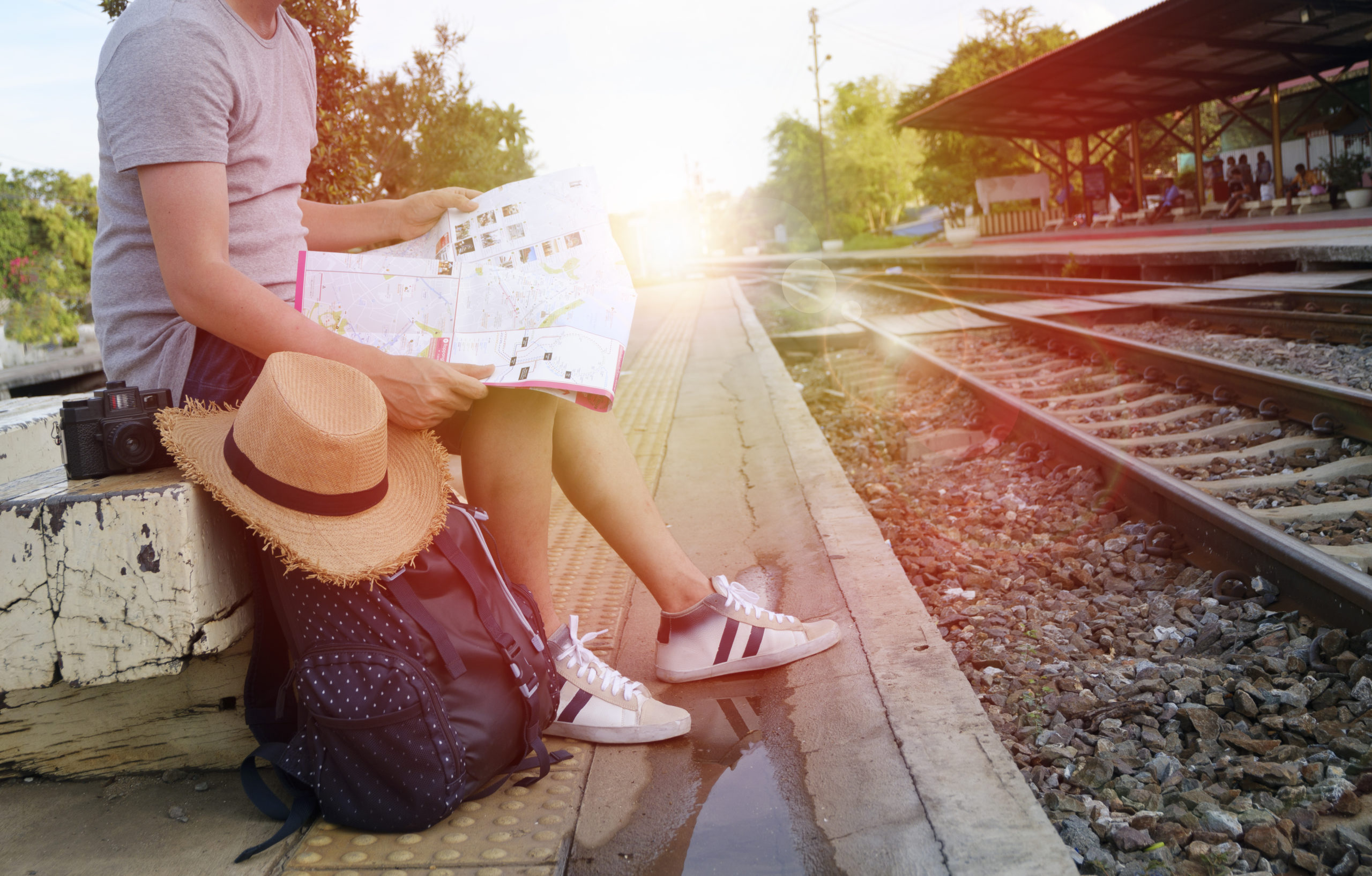 Man with a map waiting for a train