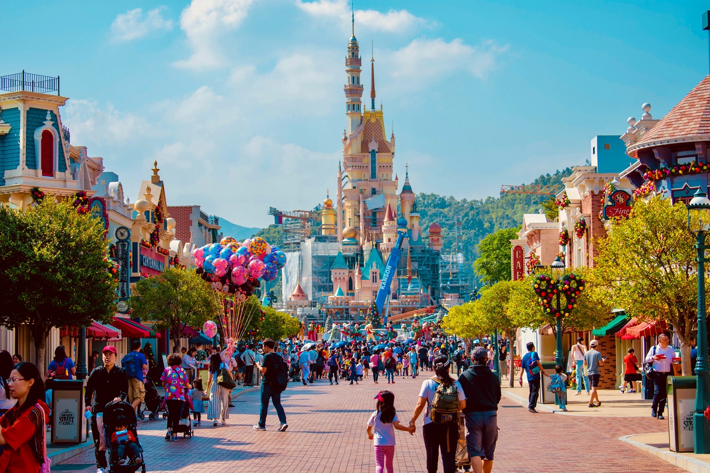 tourists visit the Disney castle at Disney World