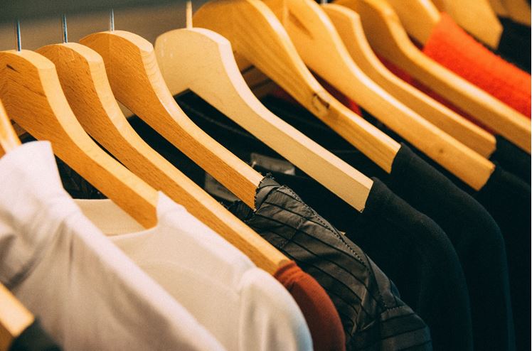 Assortment on clothes on hangers