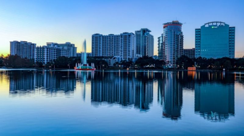 an image of buildings alongside Lake Eola on a chilly winter evening in Orlando, FL