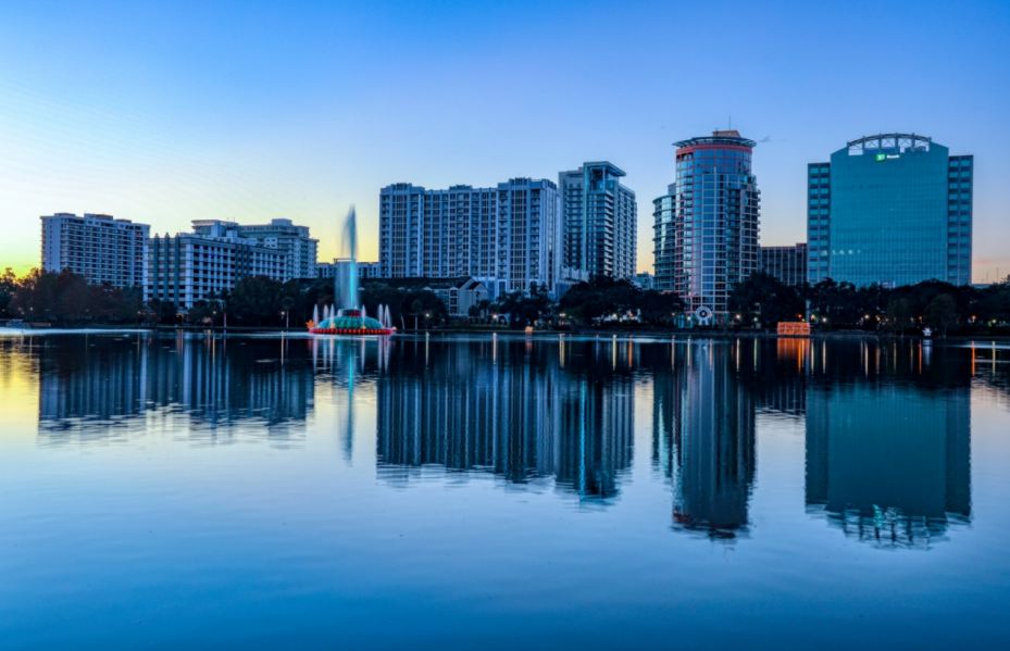 an image of buildings alongside Lake Eola on a chilly winter evening in Orlando, FL
