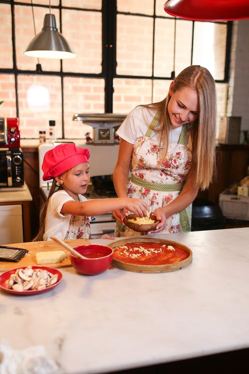 A person cooking with a child