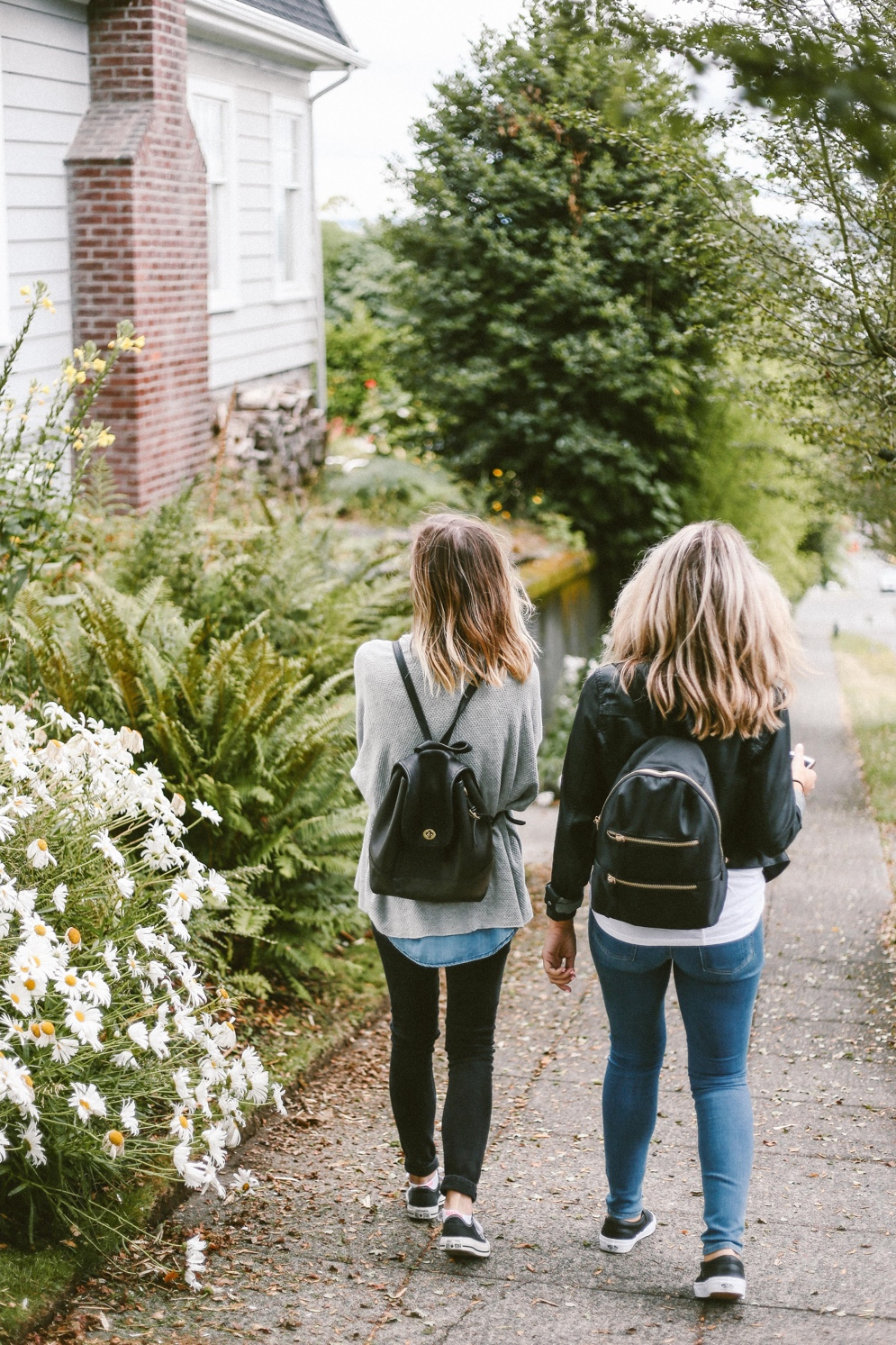 two people carrying their own bag packs